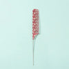 A set of anti-static rat tail combs with a red and white pattern displayed against a light blue background.