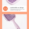 A purple professional detangling hair brush with a comfortable arc design and an ergonomic anti-slip handle.