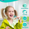 A young girl is using a blue electric toothbrush with a unicorn design to brush her teeth.