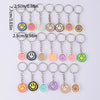 A set of 20 cartoon smile face keychains in various colors and styles displayed against a white background.