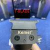 A close-up of a black Kemei T-blade hair clipper with a textured blade and mounting screws.