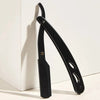 A black stainless steel folding shaving razor set is shown against a white background.