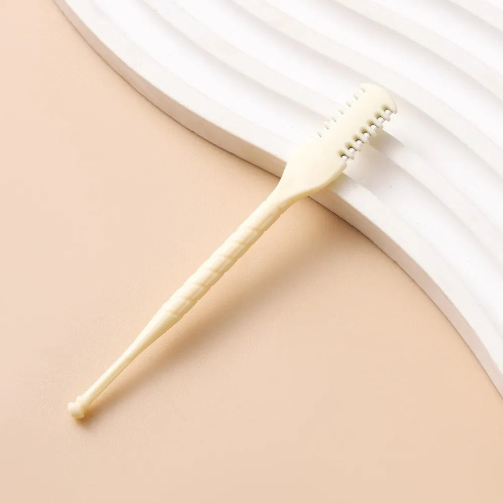 A light beige reusable double-sided nose hair trimmer resting on a soft pink background with white curved lines.