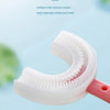 A close-up view of a white U-shaped soft rubber brush head attached to a pink handle, designed for children's teeth cleaning.