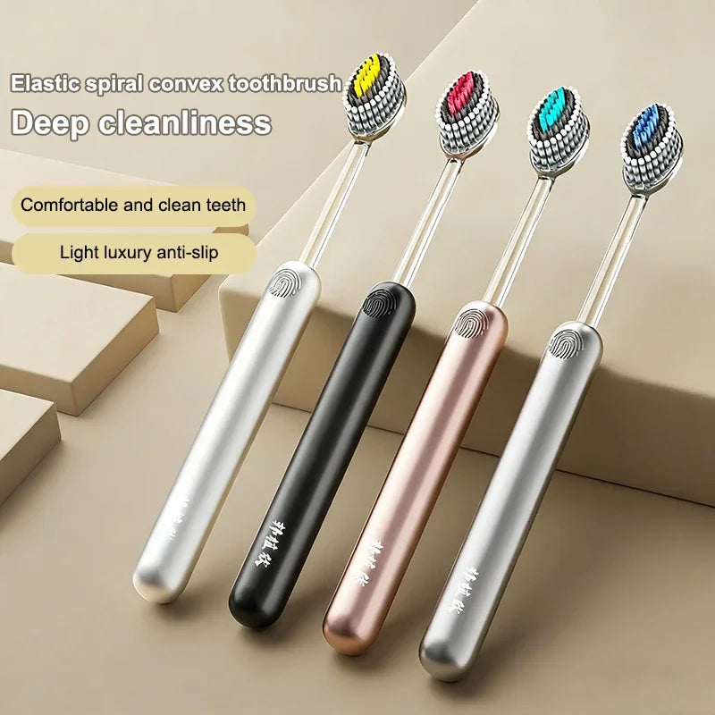 Un set de quatre brosses à dents en spirale élastiques convexes dans les tons argent, noir et rose gold.