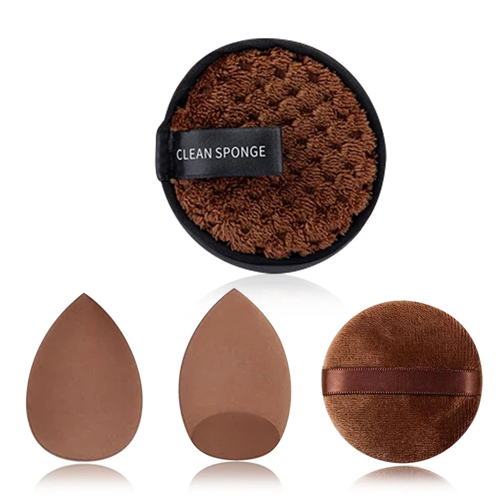 A black sponge with a brown textured surface and three round makeup sponges in various shades of brown.