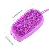 A purple silicone body brush with dense bristles shown against a white background.