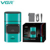 A teal VGR electric hair trimmer with a black housing and accessories shown next to its packaging.