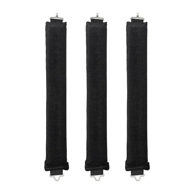 Three black heatless hair curler curling rods standing vertically.