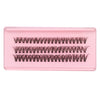 A pink plastic tray containing multiple rows of natural wispy lash clusters for DIY eyelash extensions.