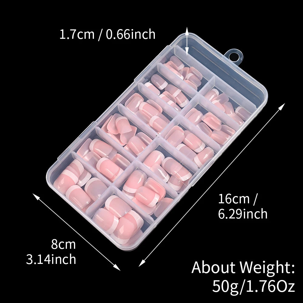 A clear plastic container holding nude pink press-on nails with white French tips.