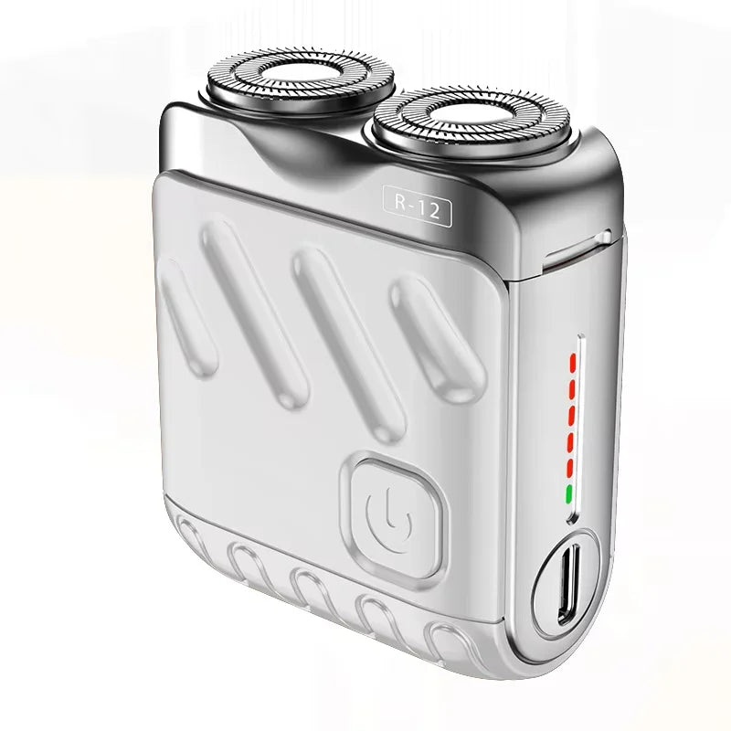 A silver electric shaver with a removable head, labeled R-12, shown from the side.