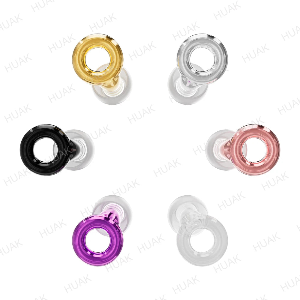 A collection of silicone ear plugs in various colors including gold, clear, black, pink, and purple.