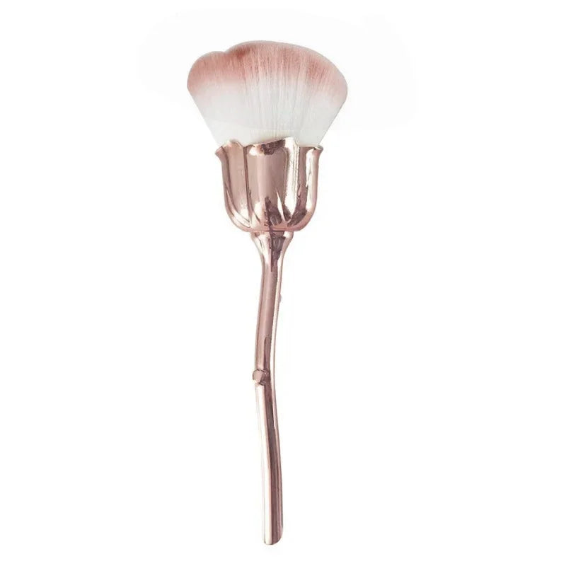 A rose gold nail art dust brush set with a fluffy brush head and handle.