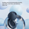 A close-up of a blue silicone ear plug floating against a blurred background of light blue spheres.
