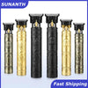 A set of five vintage cordless hair cutting and trimmer attachments in gold and black finishes.