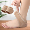 A hand is placing a tan silicone heel protector on a foot, showing the product's fit and use.