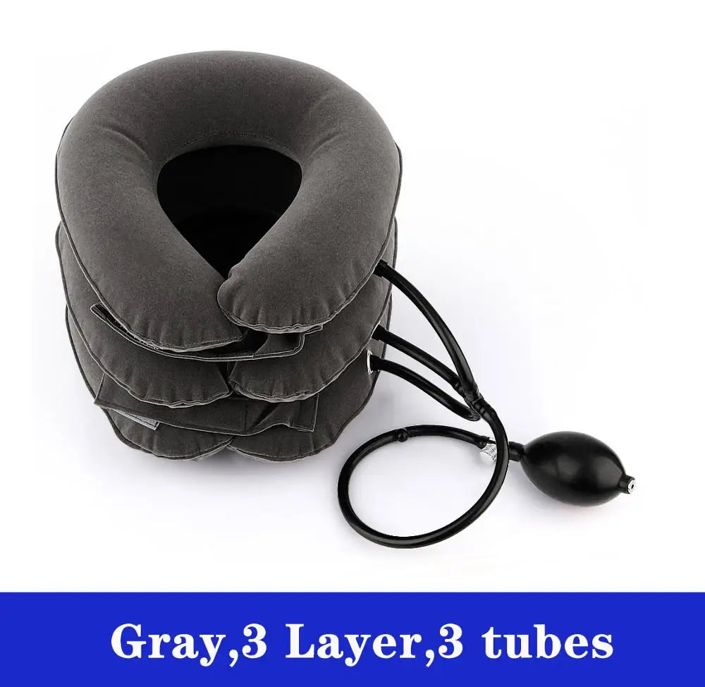 Gray three-layer inflatable cervical neck traction pillow with three tubes and a black hose