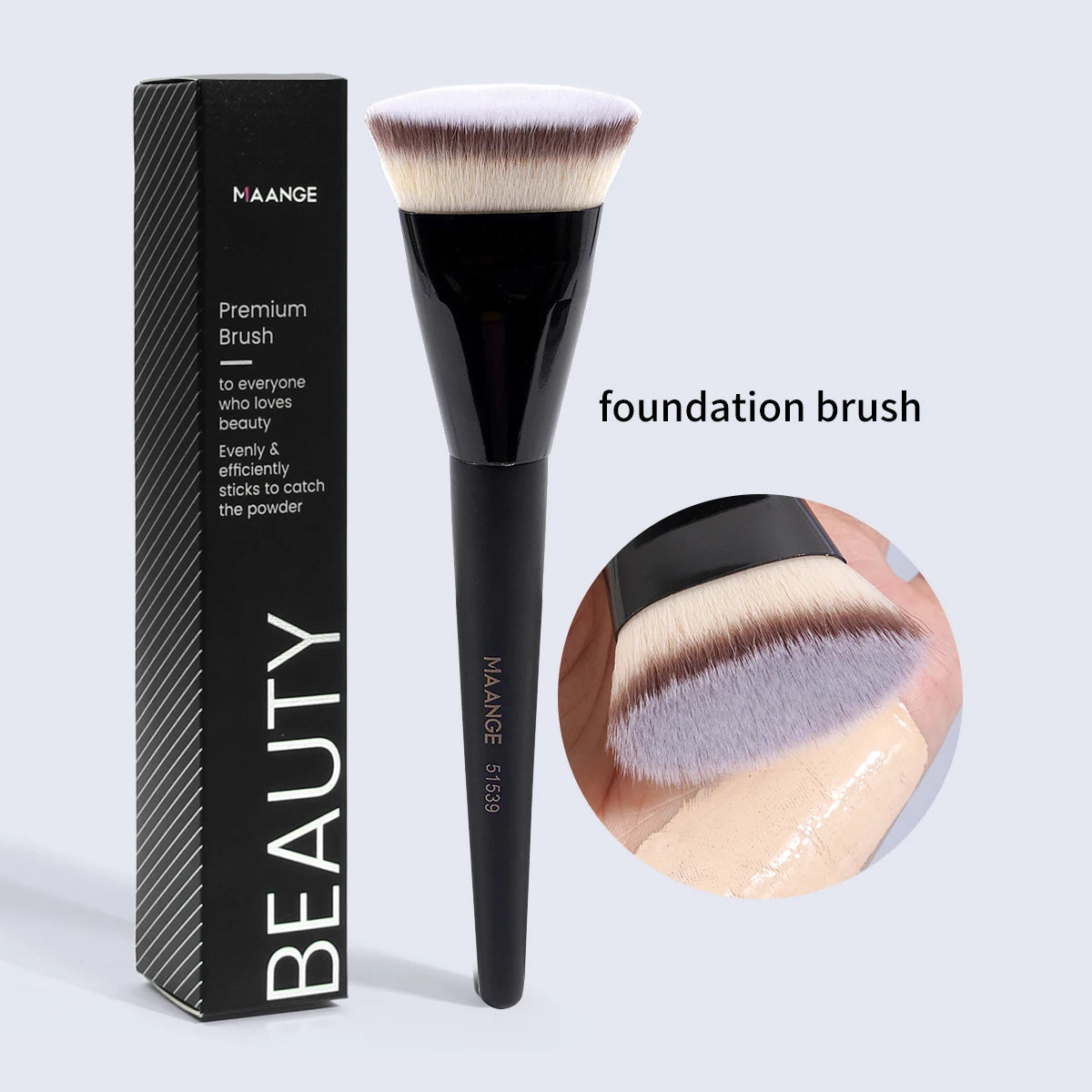 A black Maange premium foundation brush with a dense, fluffy synthetic hair is shown next to its packaging.