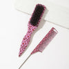 A set of two leopard print pointed tail hair combs, one black and one pink.