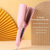 Pink V French an omelet curling iron with a textured background