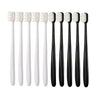 A set of ten white and black ultimate deep cleaning toothbrushes displayed in a row.