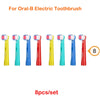 Eight replacement brush heads for Oral-B electric toothbrushes in various colors including pink, blue, and yellow.