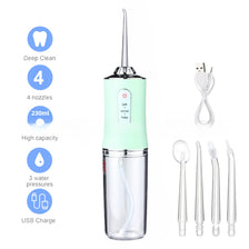 A portable USB rechargeable dental water flosser with a green body, 4 nozzles, and various tips.