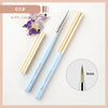 A set of professional nail art brushes with gold and light blue handles and purple flower-shaped caps.