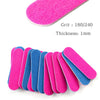 A collection of double-sided mini nail files in various colors including pink, blue, and purple.