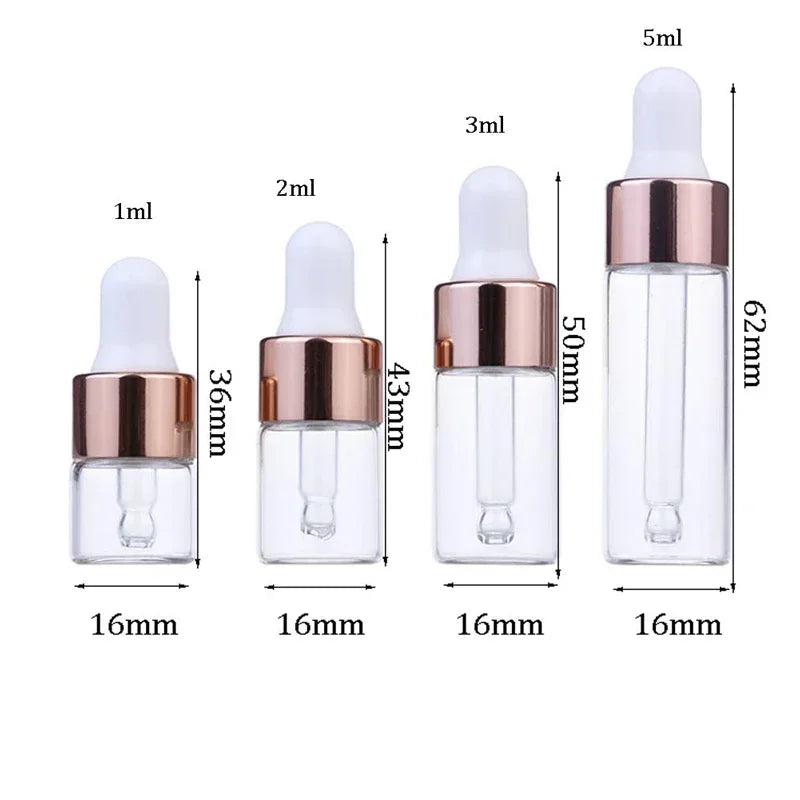 A set of ten glass dropper bottles with various volumes and rose gold caps for essential oils and samples.