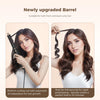 A woman is using a newly upgraded barrel curling rod to style her curly hair.