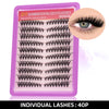 A pink plastic tray holding individual black false eyelashes for DIY lash clusters.