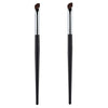 A pair of black makeup brushes used for contouring and nose shadow application.