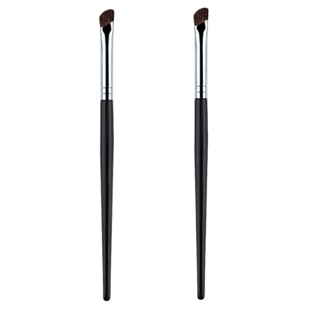 A pair of black makeup brushes used for contouring and nose shadow application.