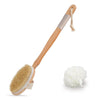 A wooden body exfoliating brush with a long handle and natural bristles next to the brush.