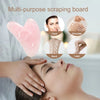Tabla de raspado de silicona rosa en forma de corazón para masaje facial y corporal.