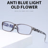 Un par de elegantes gafas de lectura antirluz azul con montura gris y lentes transparentes sobre una superficie blanca.
