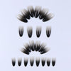 A set of 24 almond press-on nails featuring a pink bow design in various shades of black and white.