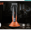 An orange VGR cordless hair trimmer is shown on a wooden surface with a man using it in a professional setting.