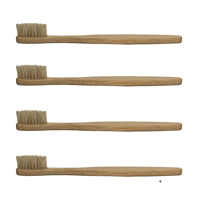 A set of four bamboo toothbrushes with natural bristles shown horizontally.