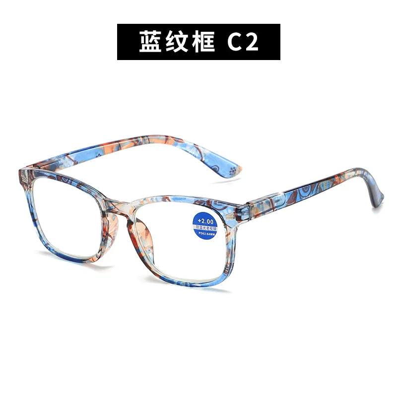 A pair of blue and orange patterned reading glasses with thin metal frames.