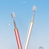 A silver and pink sonic vibrating toothbrush is shown standing upright on a white surface.