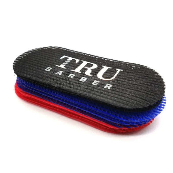 Black and red dual hair gripper and styling tool set with the brand name TRU BARBER printed on it
