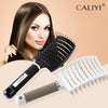 A woman models a Caliyi curved vented hair brush, showing the brush and its handle.