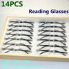 A wooden box containing 14 pairs of frameless anti-blue light reading glasses in various styles.