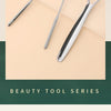A set of reusable stainless steel beauty tools including a tongue scraper and oral brush displayed on a light background.