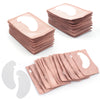 Pile de patchs hydrogélifiés roses pour extensions de cils, avec des pads individuels en dessous.