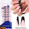 A hand displays soft gel tips in nude pink matte French press on nail designs.