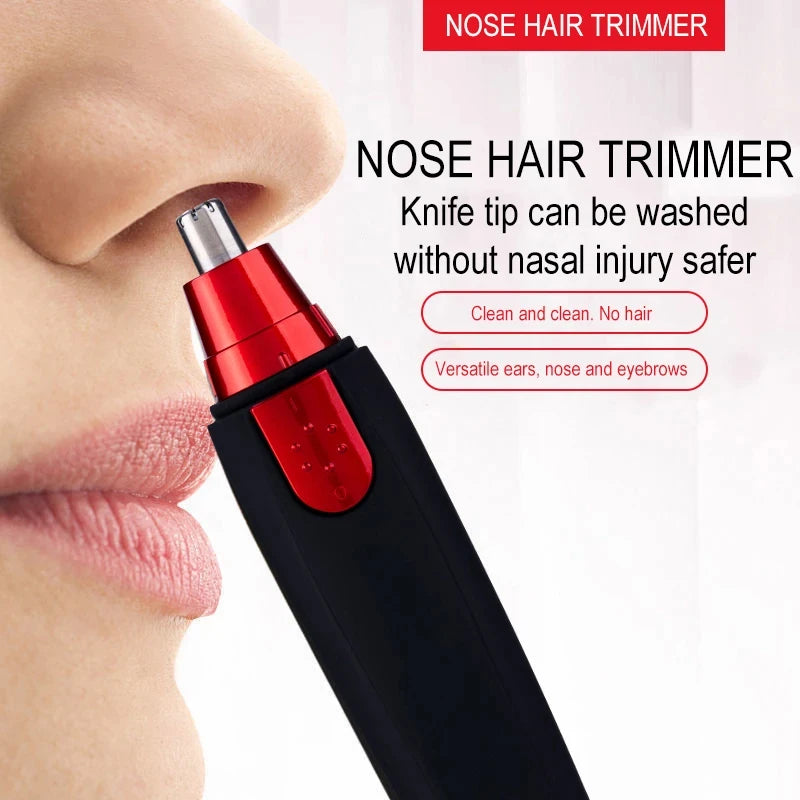 A close-up of a red and black nose hair trimmer device being used on a person's nose.